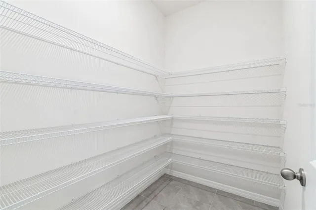 a view of an empty room and wooden floor