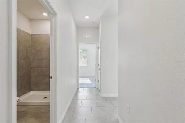 a bathroom with a granite countertop sink a toilet and a mirror