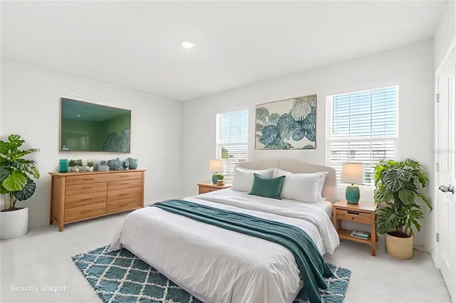 an aerial view of residential building and lake