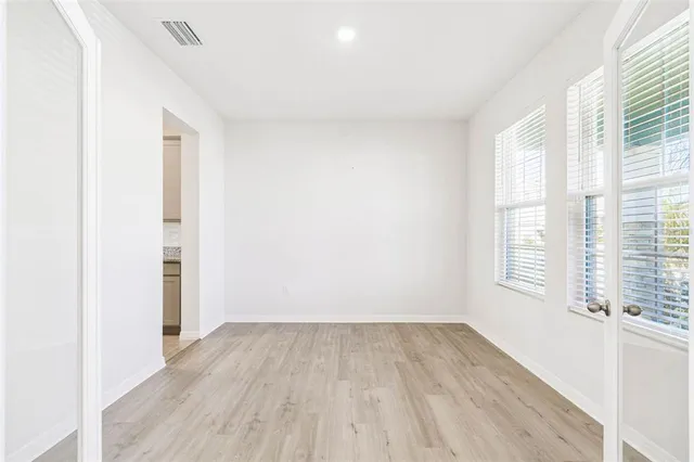 a view of an entryway with wooden floor