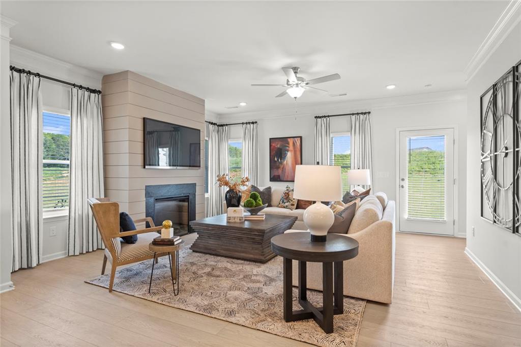 16 Willow Circle Rock Spring, GA 30739 - Photo 13 of 30 a living room with furniture a fireplace and a large window