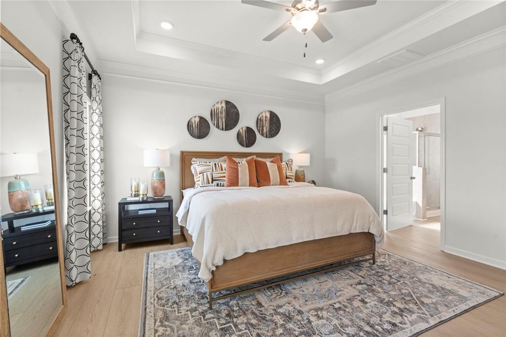 16 Willow Circle Rock Spring, GA 30739 - Photo 21 of 30 a bedroom with a bed and a chandelier