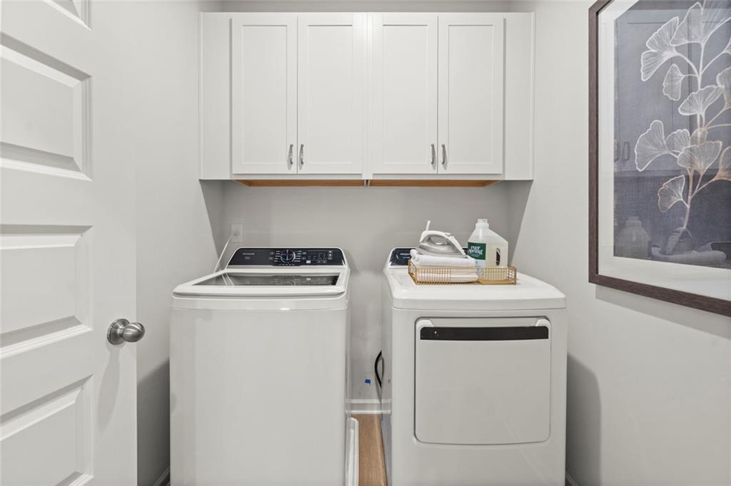 16 Willow Circle Rock Spring, GA 30739 - Photo 27 of 30 a view of washer and dryer with white cabinet
