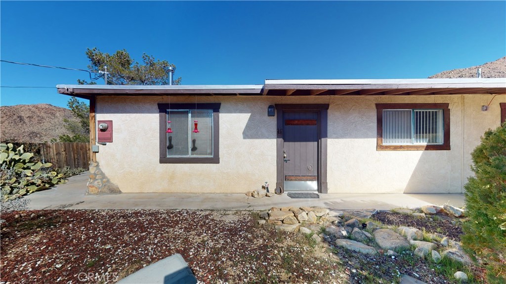 25636 Flathead Road Apple Valley, CA 92307 - Photo 1 of 1 a front view of a house