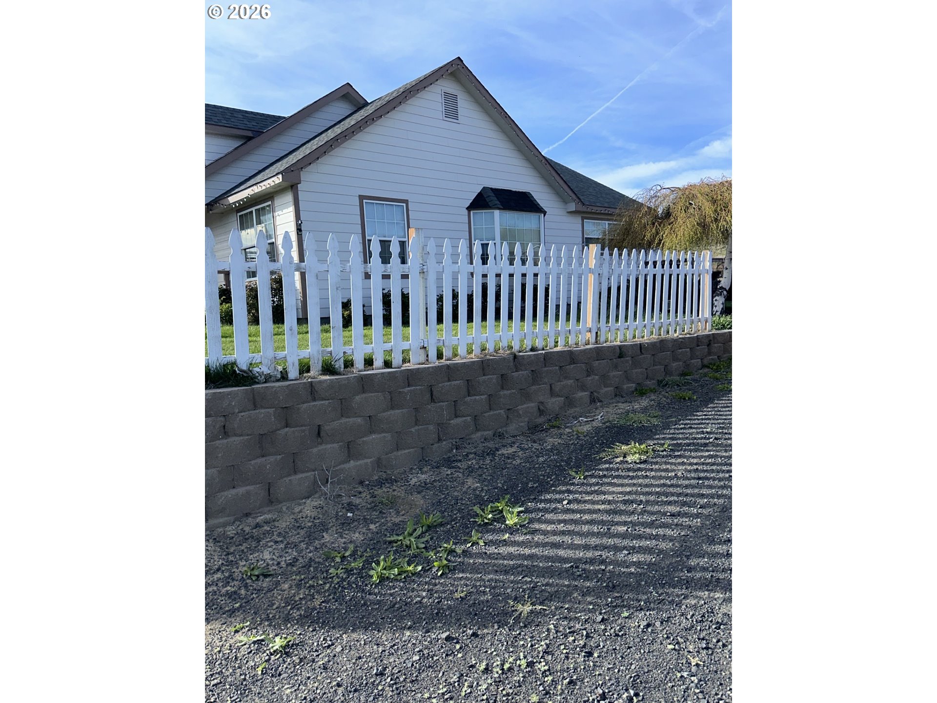 535 Emert Road Ione, OR 97843 - Photo 3 of 24 a view of a house with a small yard and wooden floor