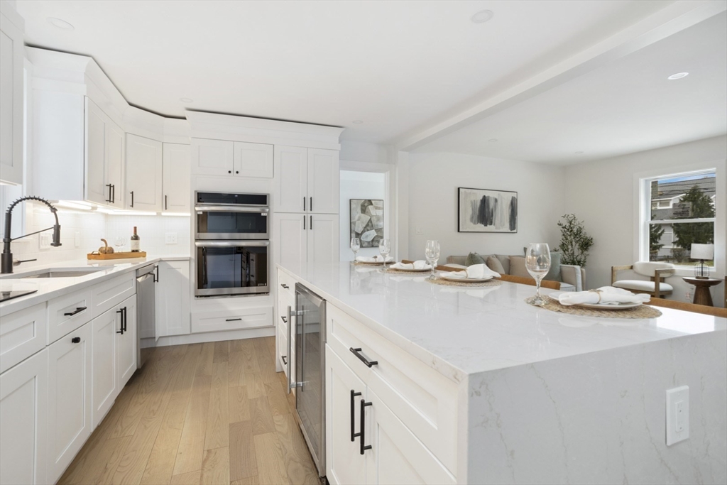 63 Kellogg Street Framingham, MA 01701 - Photo 11 of 38 a kitchen with cabinets a sink and white appliances
