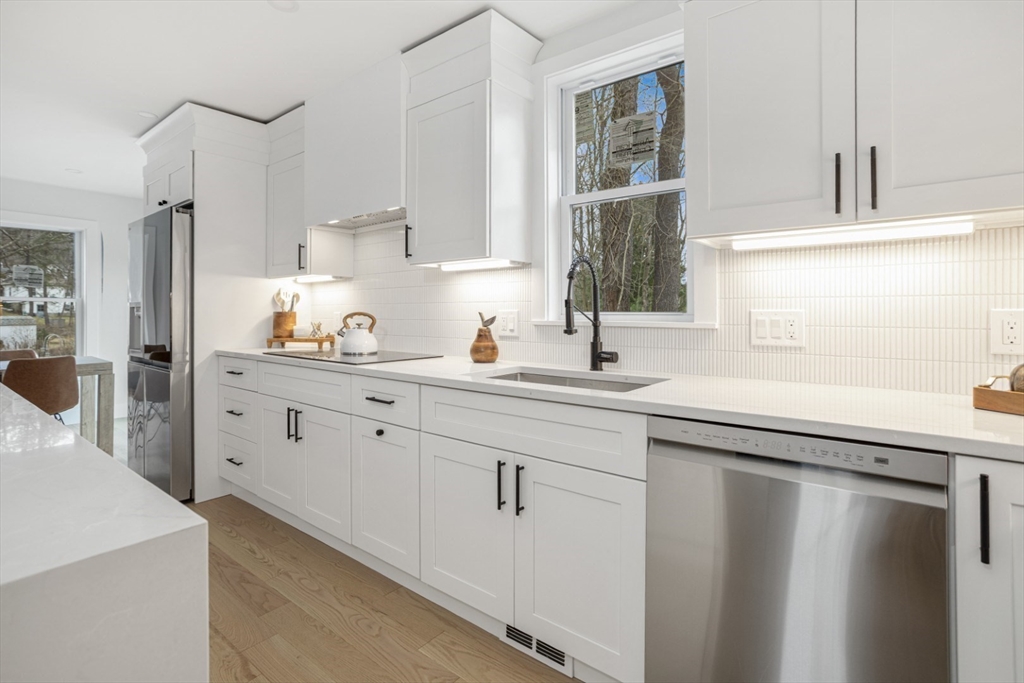 63 Kellogg Street Framingham, MA 01701 - Photo 12 of 38 a kitchen with white cabinets and sink
