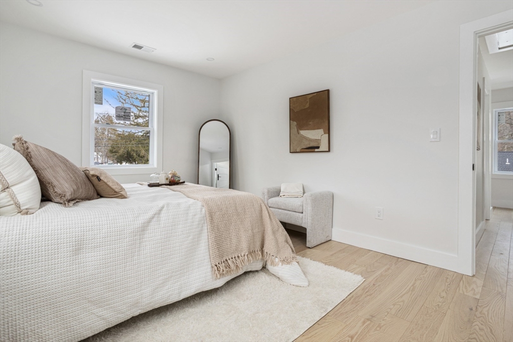 63 Kellogg Street Framingham, MA 01701 - Photo 21 of 38 a bedroom with a bed and a couch