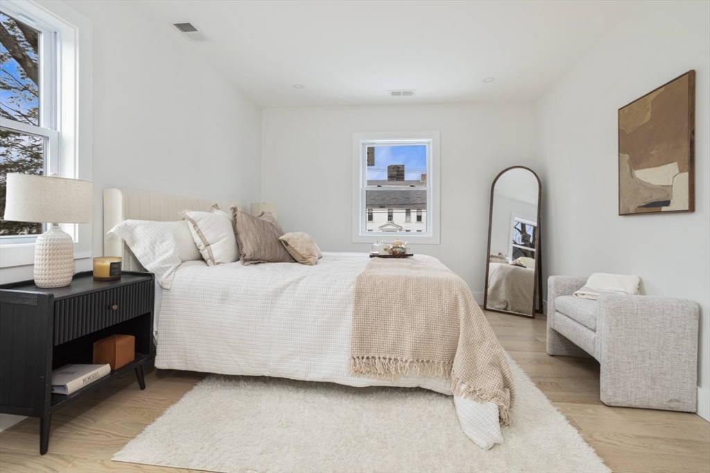 63 Kellogg Street Framingham, MA 01701 - Photo 22 of 38 a bedroom with a bed and a dresser