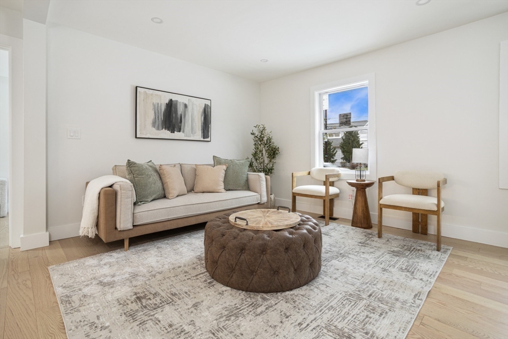 63 Kellogg Street Framingham, MA 01701 - Photo 3 of 38 a living room with furniture and a couch