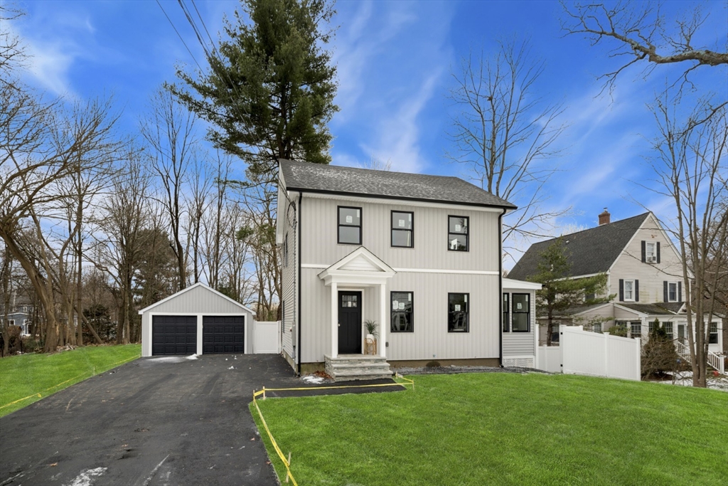 63 Kellogg Street Framingham, MA 01701 - Photo 32 of 38 a front view of a house with a yard