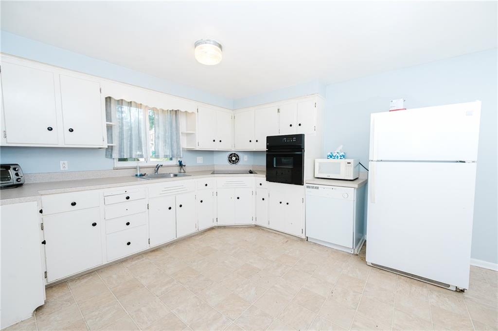 1162 Water Street Indiana, PA 15701 - Photo 8 of 26 a kitchen with cabinets appliances a sink a counter top space and cabinets