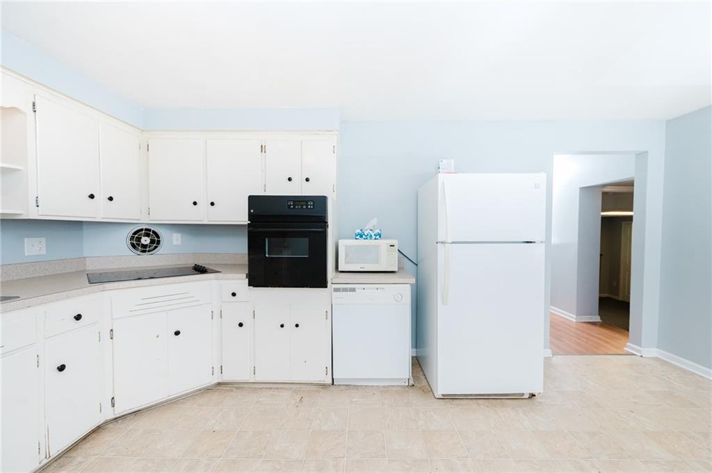 1162 Water Street Indiana, PA 15701 - Photo 9 of 26 a kitchen with white cabinets and refrigerator