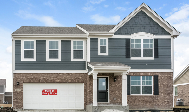 2097 Rownham Hill Road New Lenox, IL 60451 - Photo 1 of 13 a view of a brick house with large windows