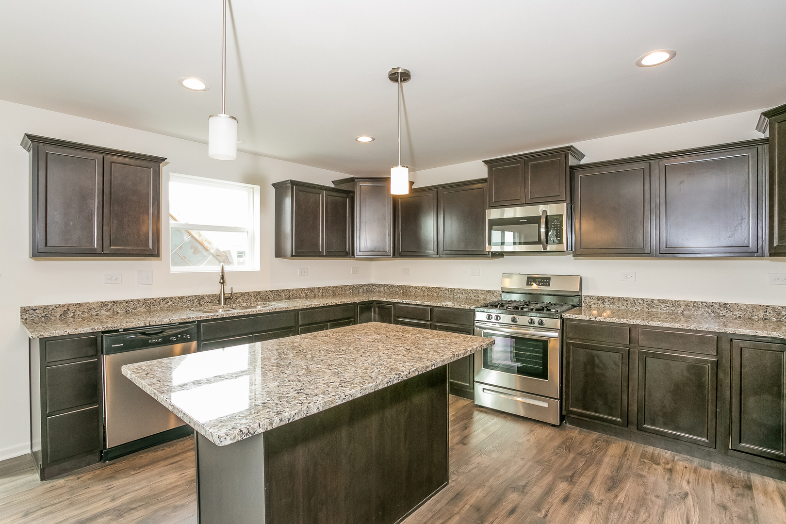 2097 Rownham Hill Road New Lenox, IL 60451 - Photo 3 of 13 a kitchen with granite countertop a sink stove and refrigerator