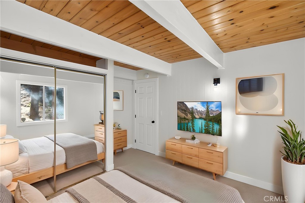 26980 Everest Road Lake Arrowhead, CA 92391 - Photo 22 of 49 1st floor bedroom virtually staged.