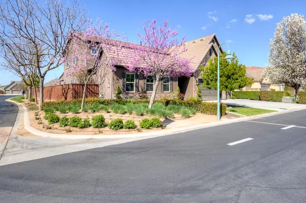 a kitchen with stainless steel appliances granite countertop a sink refrigerator and microwave