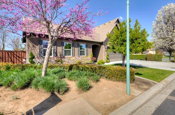 a kitchen with stainless steel appliances granite countertop a stove and cabinets