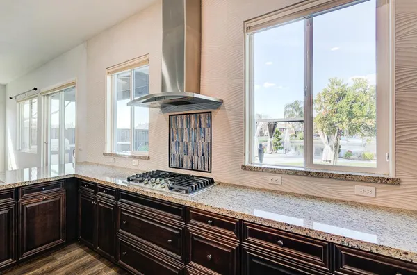 a kitchen with a sink and cabinets