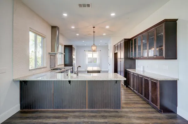 a view of room with wooden floor