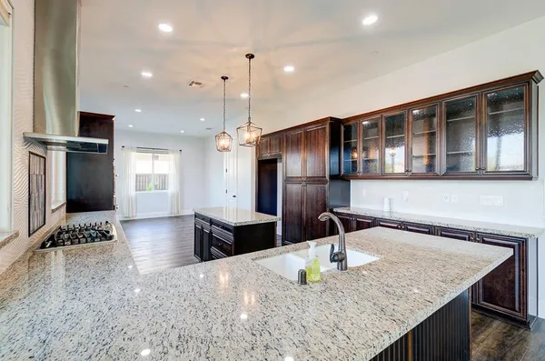 a view of kitchen with cabinets and wooden floor