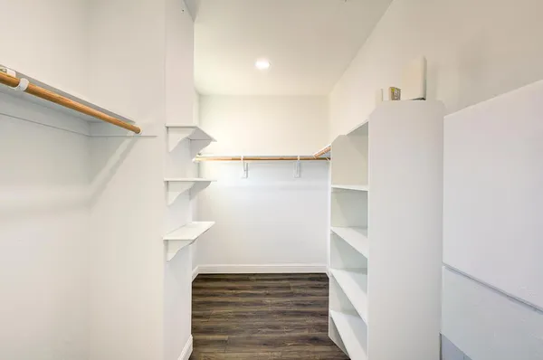 an aerial view of a house with a garden and lake view