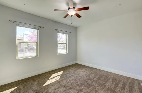 an aerial view of a house with a garden and lake view
