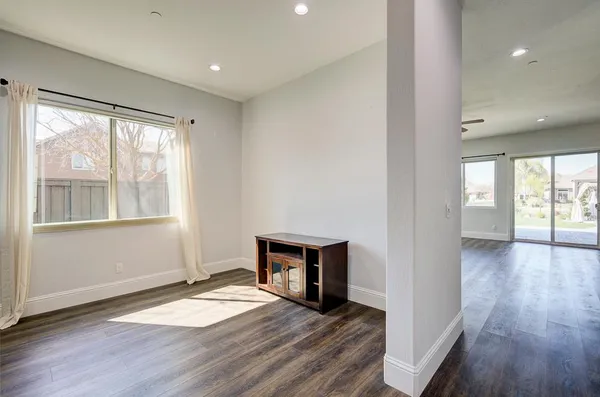 a view of a swimming pool with an outdoor seating and a yard