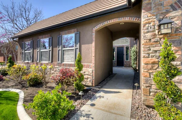 a kitchen that has a sink a stove and a oven