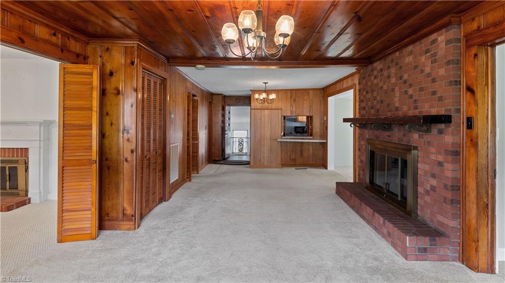 615 Pine Ridge Road Lexington, NC 27295 - Photo 22 of 33 In the Den, notice the large wide mantle over the floor to ceiling brick fireplace