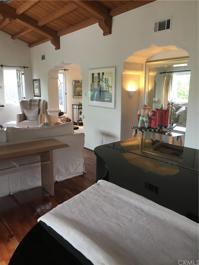 175 Granada Avenue Long Beach, CA 90803 - Photo 6 of 29 Looking across the piano towards the arch that opens to the dining room.