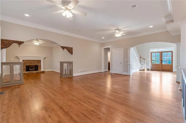 a kitchen with stainless steel appliances granite countertop a refrigerator a sink dishwasher and a stove