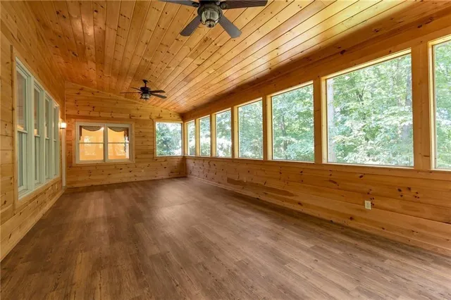 a bathroom with a granite countertop sink a mirror and a vanity