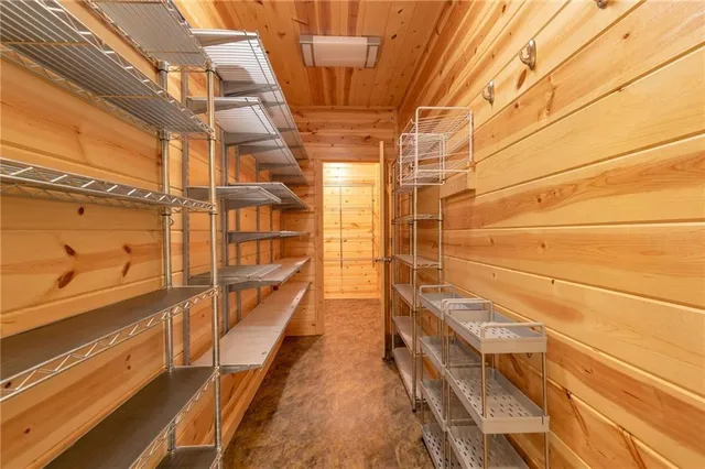 a bathroom with a granite countertop sink a mirror and vanity
