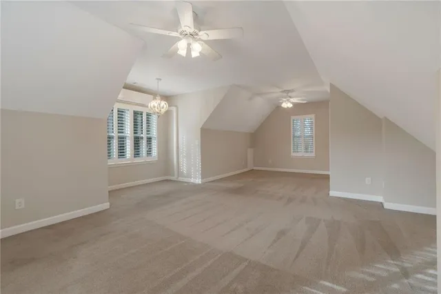 a view of a house with a patio and a yard