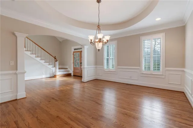 wooden floor in an empty room with a fireplace