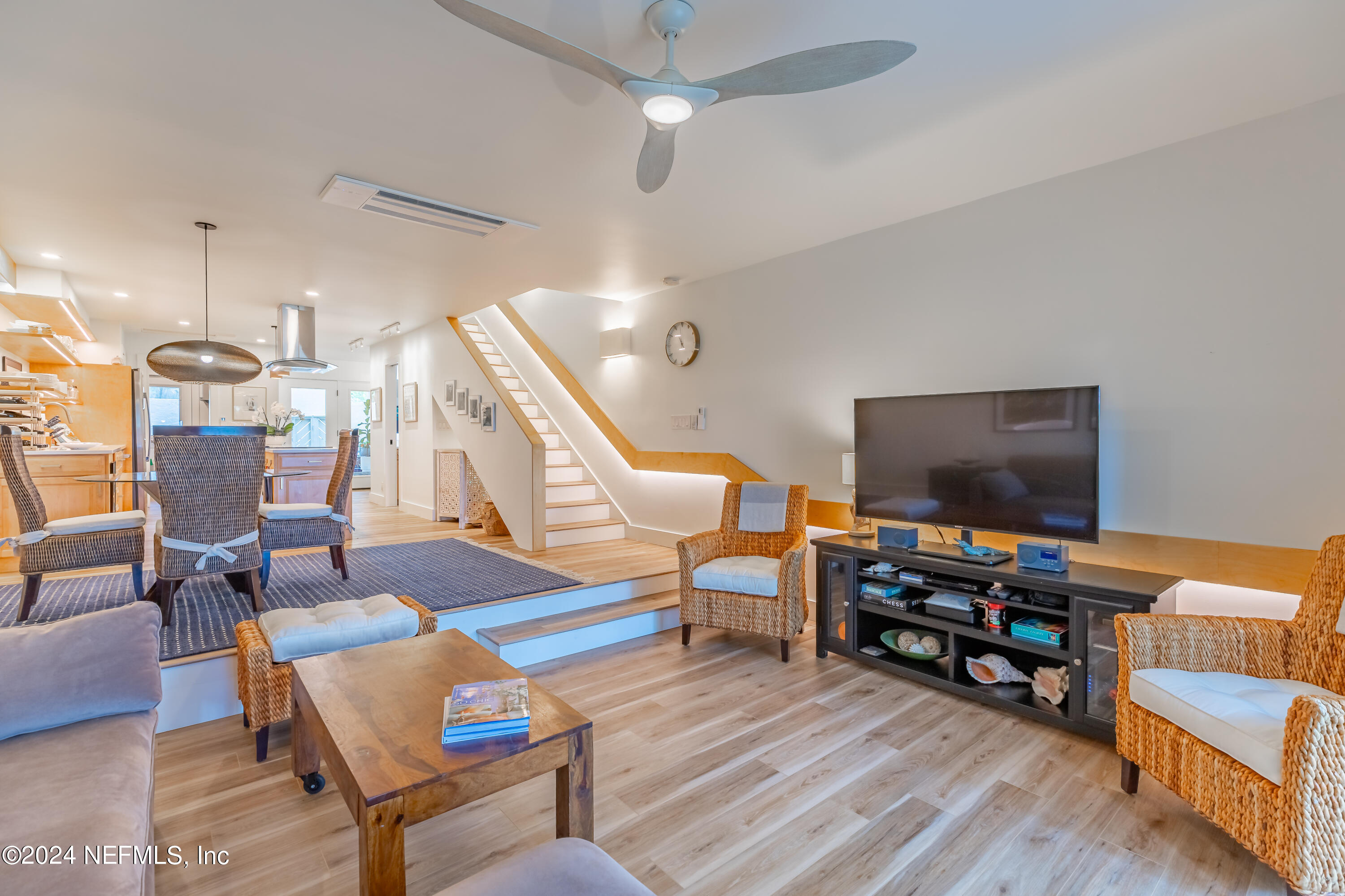 3025 Sea Marsh Road Fernandina Beach, FL 32034 - Photo 14 of 54 a living room with furniture and a flat screen tv
