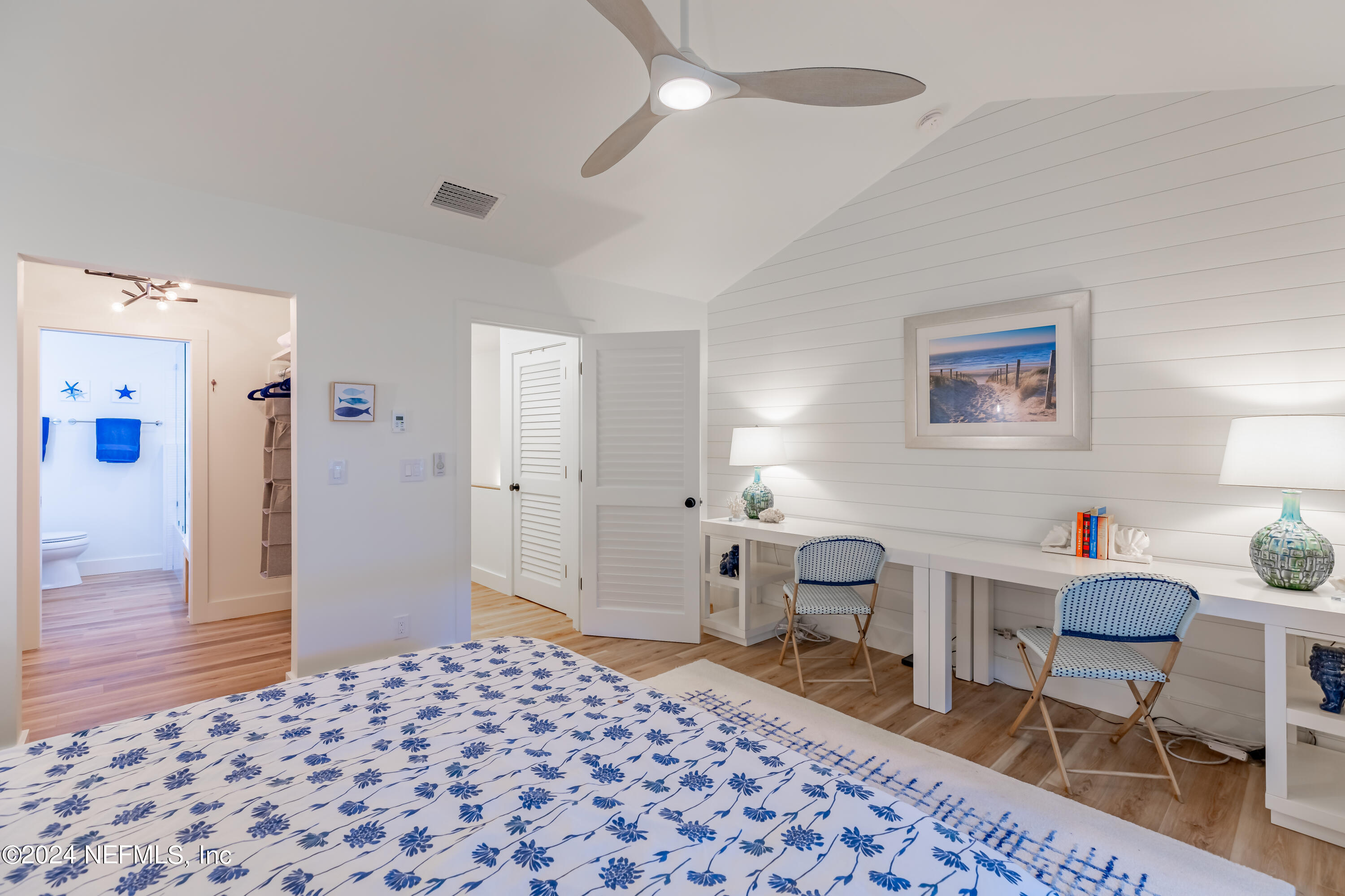 3025 Sea Marsh Road Fernandina Beach, FL 32034 - Photo 22 of 54 a bedroom with a bed and a desk