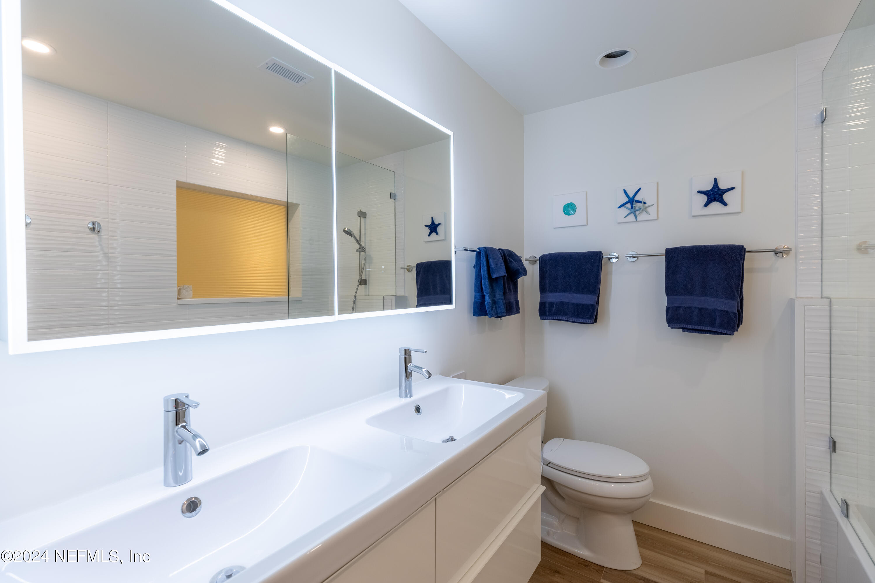 3025 Sea Marsh Road Fernandina Beach, FL 32034 - Photo 27 of 54 a bathroom with a sink and a mirror