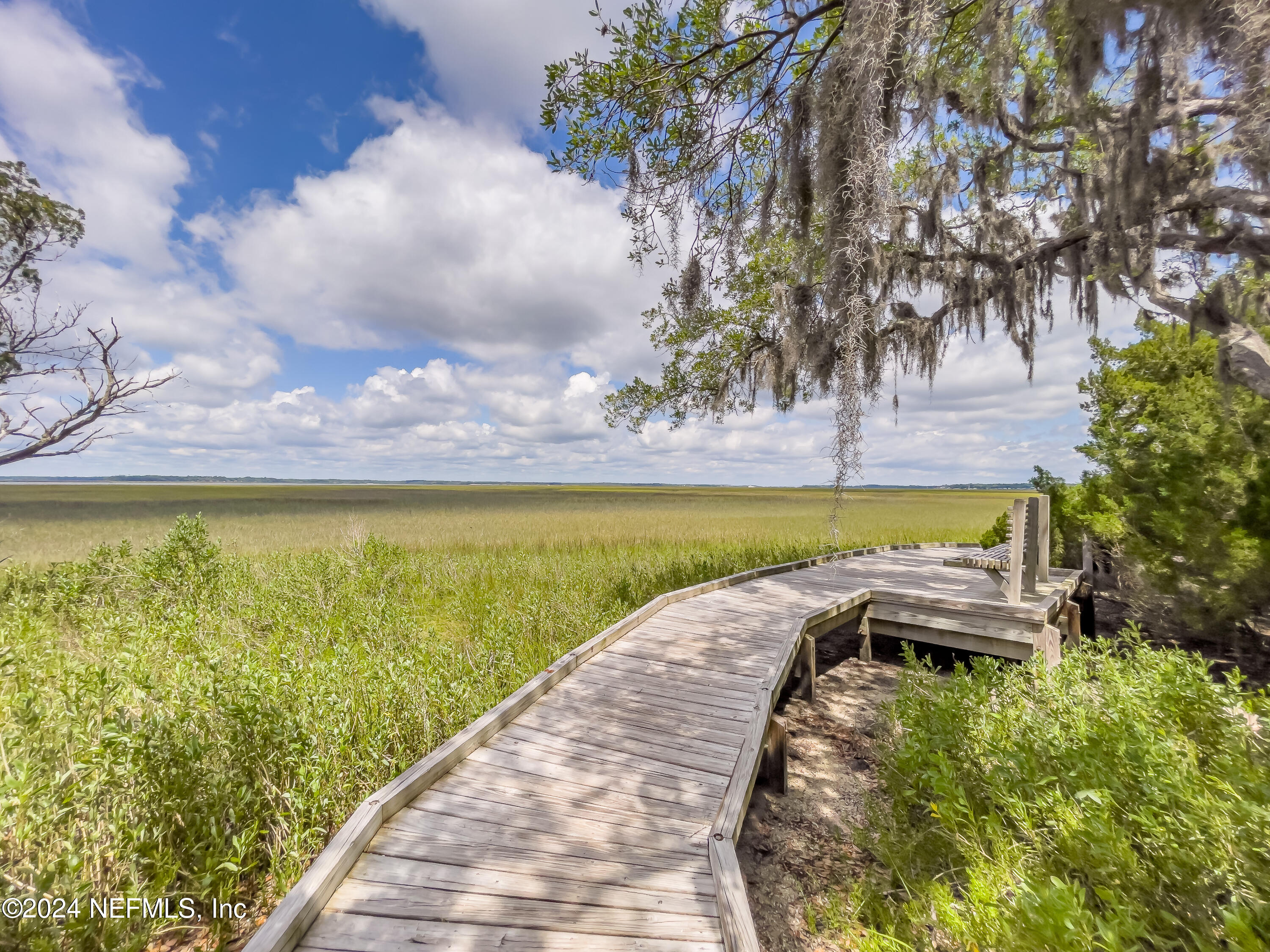 3025 Sea Marsh Road Fernandina Beach, FL 32034 - Photo 44 of 54 a view of a swimming pool with an outdoor space and seating area