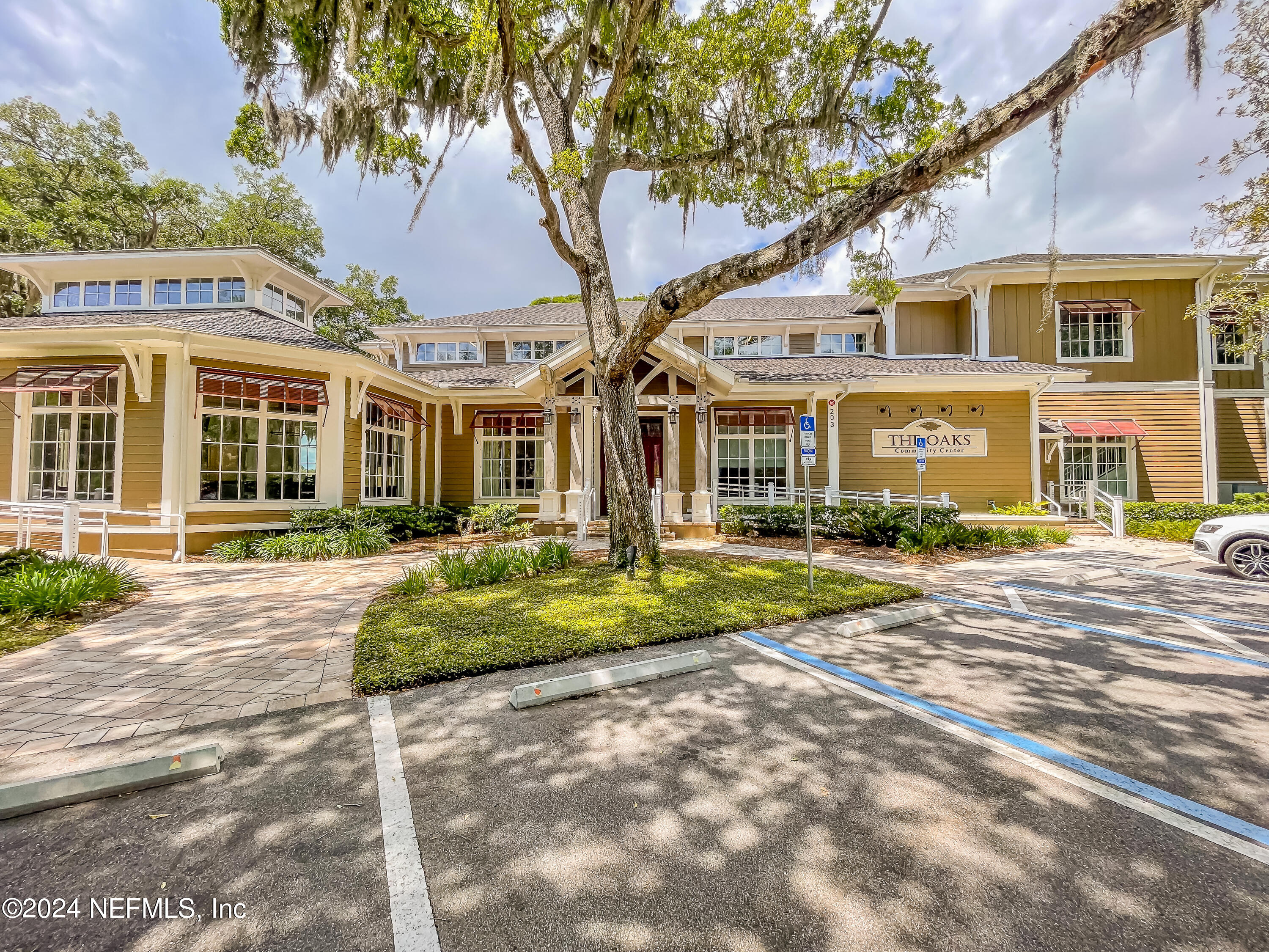 3025 Sea Marsh Road Fernandina Beach, FL 32034 - Photo 47 of 54 a front view of a residential apartment building with a yard