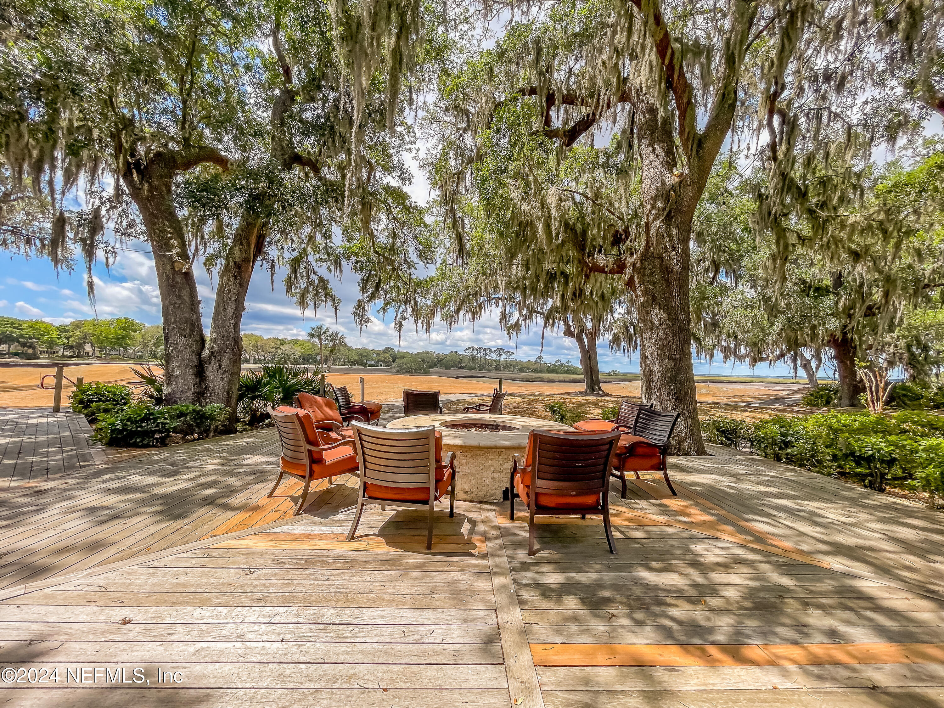 3025 Sea Marsh Road Fernandina Beach, FL 32034 - Photo 54 of 54 a backyard of a house with outdoor seating