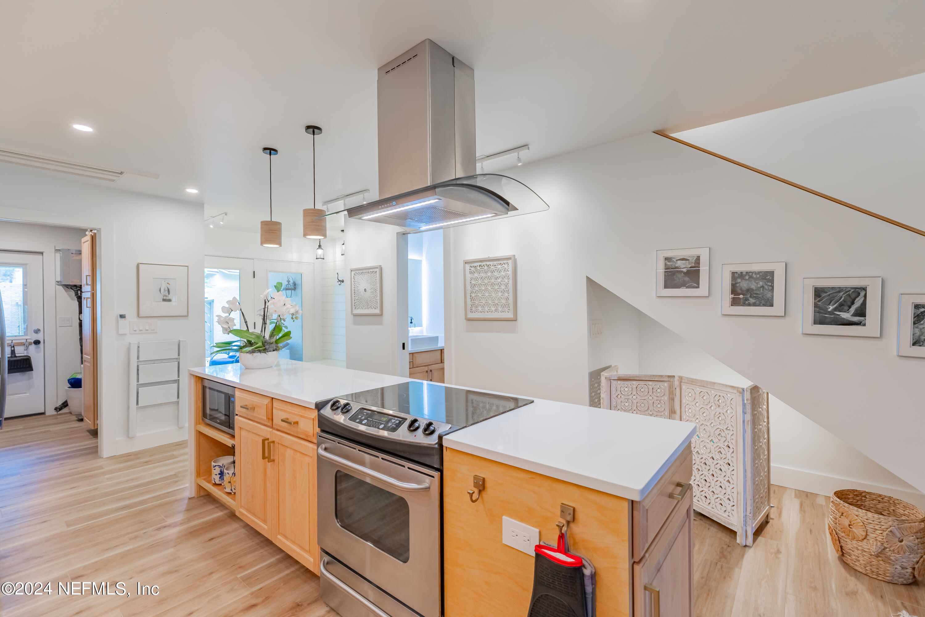 3025 Sea Marsh Road Fernandina Beach, FL 32034 - Photo 8 of 54 a kitchen with a stove and a wooden floors