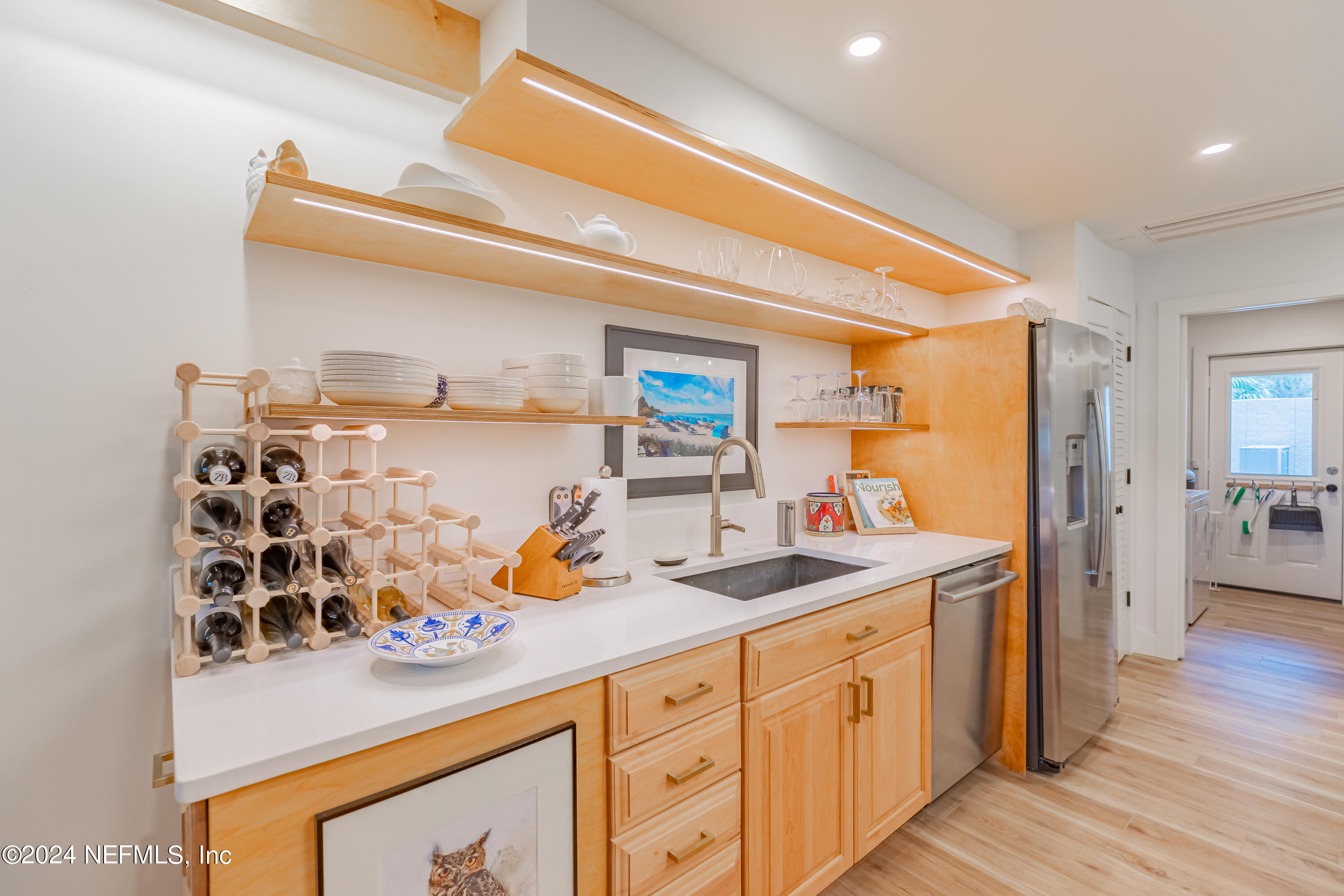 3025 Sea Marsh Road Fernandina Beach, FL 32034 - Photo 9 of 54 a kitchen with stainless steel appliances granite countertop a sink and cabinets