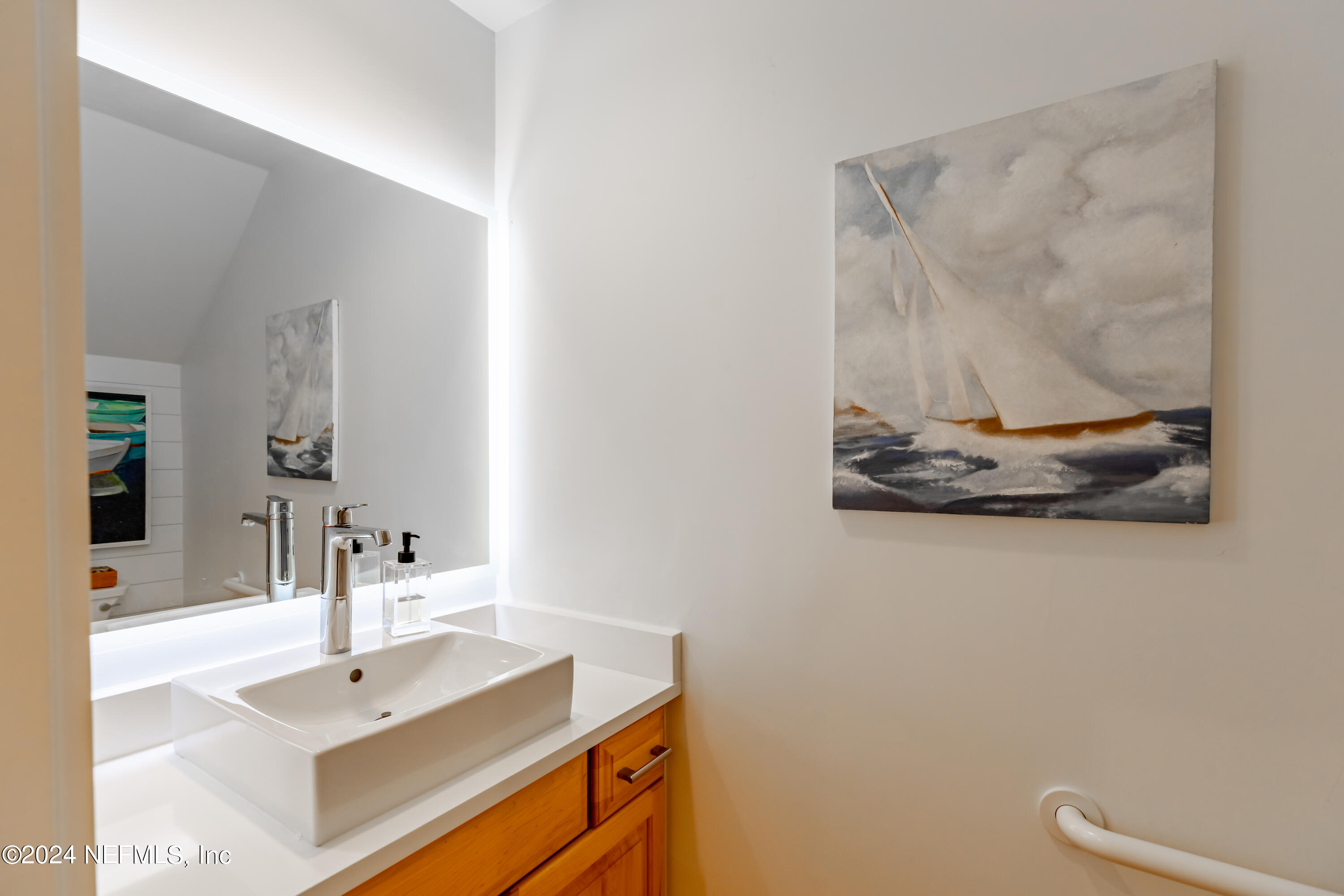3025 Sea Marsh Road Fernandina Beach, FL 32034 - Photo 10 of 54 a bathroom with a sink and a mirror