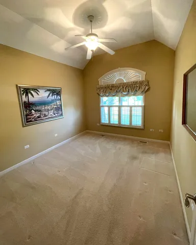 a view of a bedroom with a chandelier