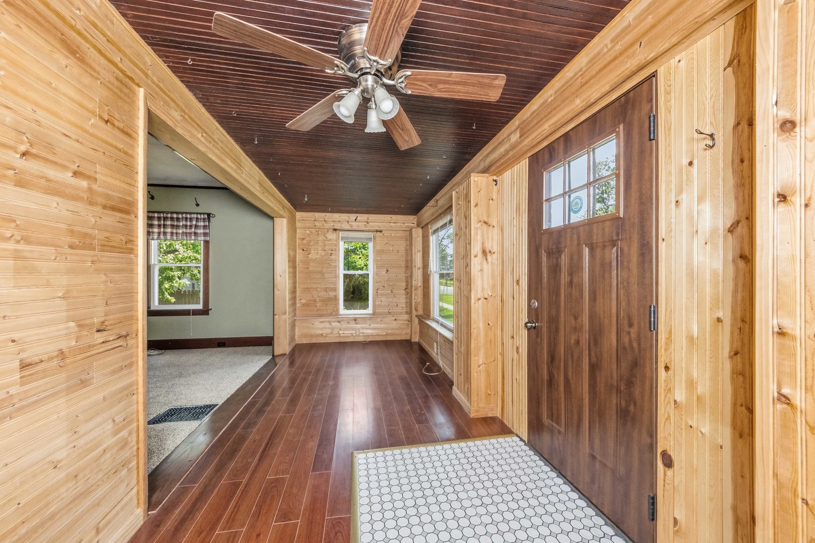 412 West 5th Street Minonk, IL 61760 - Photo 7 of 23 a view of a hallway with wooden floor and a large window