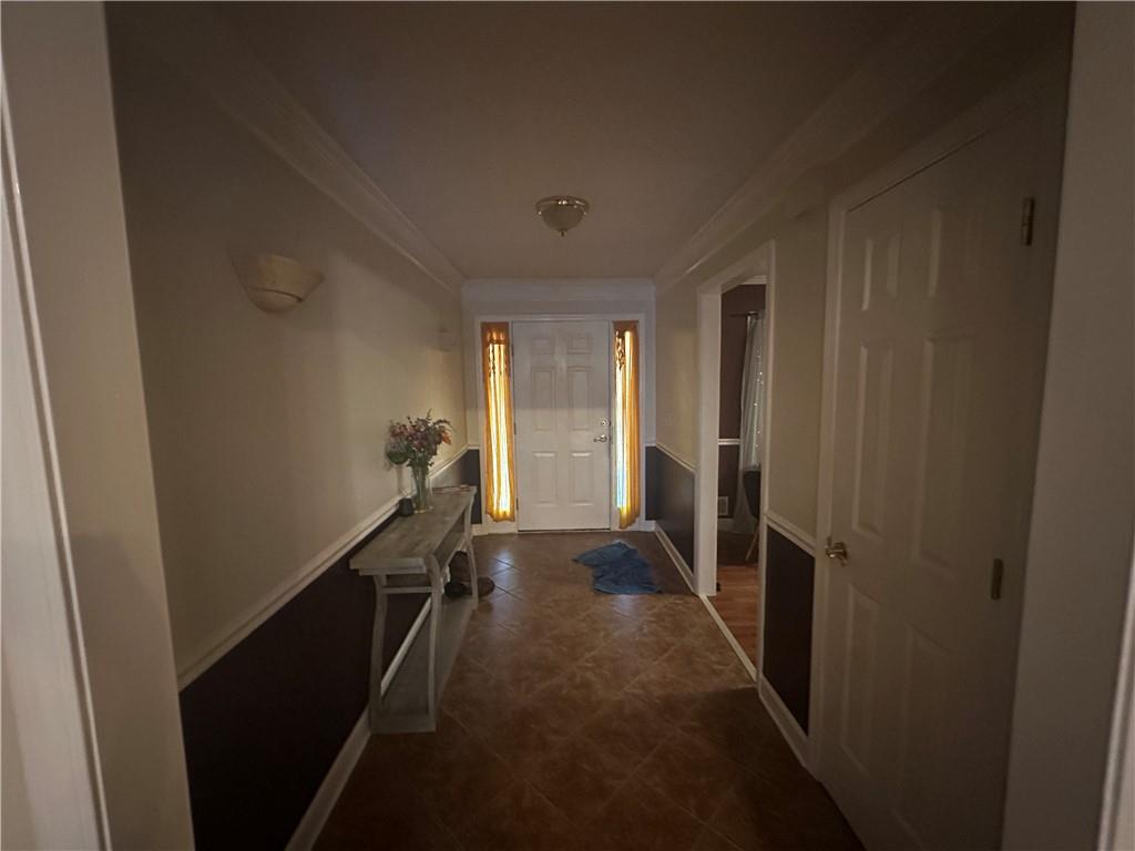 34 Deer Trail Stockbridge, GA 30281 - Photo 11 of 44 a view of a hallway with wooden floor and stairs