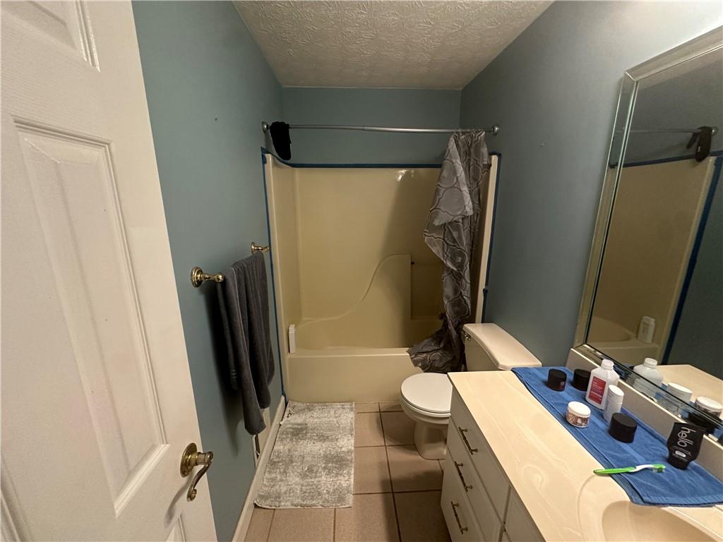 34 Deer Trail Stockbridge, GA 30281 - Photo 15 of 44 a bathroom with a tub sink and a mirror