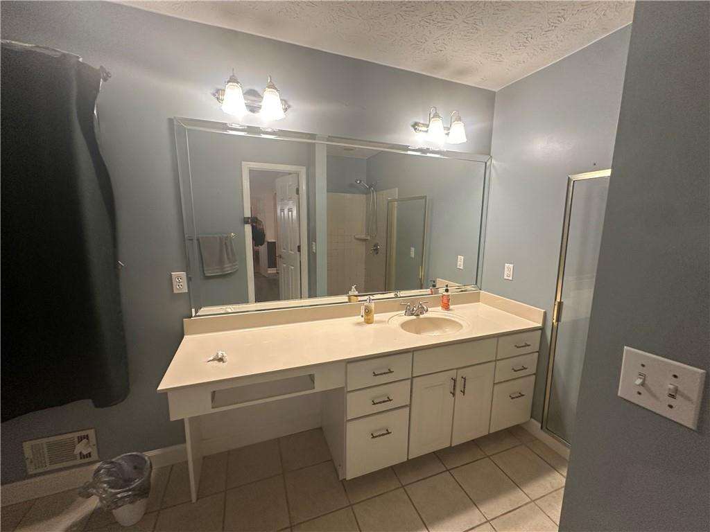 34 Deer Trail Stockbridge, GA 30281 - Photo 17 of 44 a bathroom with a double vanity sink and mirror
